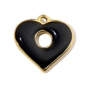 Close-up of heart-shaped stainless steel pendant with black enamel and gold plating