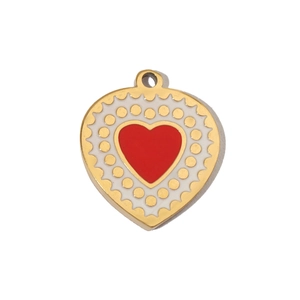 Detailed macro of heart pendant with red enamel inlay and golden scalloped metal border