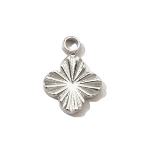 Detail of silver stainless steel four-leaf clover pendant with sunburst texture engraving