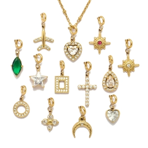 Gold stainless steel pendants with heart and star charms featuring cubic zirconia