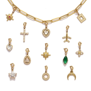 Gold stainless steel paperclip necklace with various zircon charms like heart and star