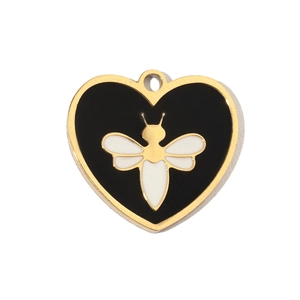 Macro shot of a heart-shaped pendant with black enamel finish and gold bee motif
