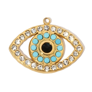 Detail of evil eye pendant with blue stones and white rhinestones in gold plating