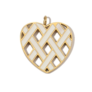 Close-up of heart-shaped gold-plated pendant with white woven pattern and top ring