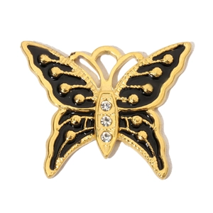 Detail of butterfly pendant in gold and black enamel with three inlaid crystals