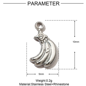 Macro view of silver banana pendant with smiley face engraving and clear rhinestone