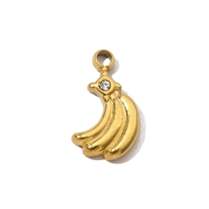 Detailed view of a gold-plated banana pendant with a single sparkling zircon stone