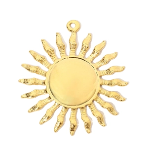Detailed view of sun-shaped pendant with polished gold finish and radial rays