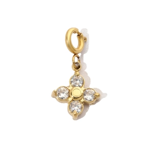 Detail showing a gold-plated flower charm with sparkling cubic zirconia on a white background