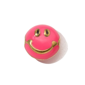 Detailed macro view of a bright pink enamel smiley face bead charm for DIY necklaces