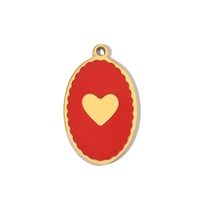 Detail of an oval stainless steel pendant with red enamel and a golden heart design