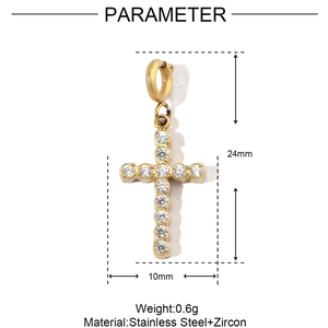 Detailed view of a gold stainless steel cross pendant with cubic zirconia stones