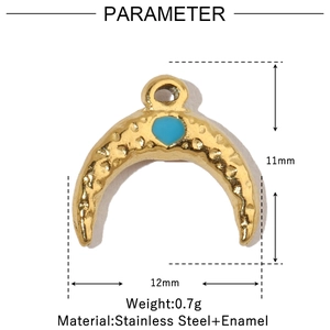 Detail of crescent moon pendant with hammered gold texture and blue heart enamel inlay