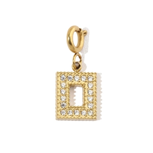 Detailed macro view of gold rectangular charm with pave zircon stones and spring clasp