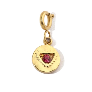 Detail of round gold pendant with heart-shaped pink zircon inlay and double link ring