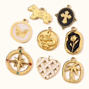 Collection of eight gold-plated stainless steel charms featuring vintage French style designs