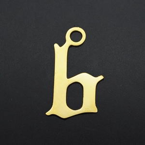 Close-up of a gold-plated stainless steel pendant featuring a Gothic style letter H