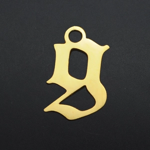Detailed view of lowercase gothic letter g gold-plated stainless steel pendant with ring