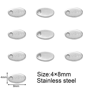 Macro view of 4x8mm oval stainless steel charms for jewelry making with S.steel engraving