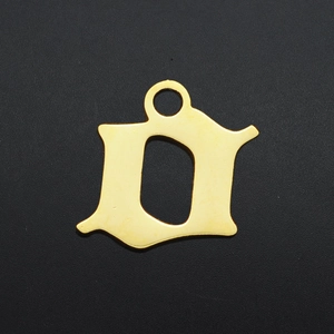 Detailed close-up of a gold-plated Gothic style small letter 'a' steel pendant charm