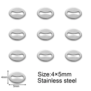 Detailed macro view of 4x5mm oval stainless steel jewelry extension tags in silver
