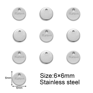 Detailed macro view of 6x6mm circular stainless steel tag with S.Steel engraving