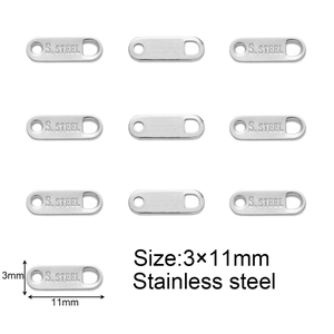 Macro detail of 3x11mm stainless steel jewelry connectors with S.STEEL engraving