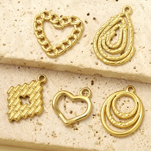 Golden titanium steel jewelry charms set with hollow hearts and textured teardrop shapes