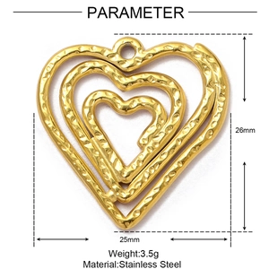 Detail of 26mm gold hammer textured stainless steel triple layered heart pendant