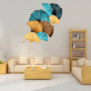Detail of 3D ginkgo leaf wall decor with metallic texture and blue yellow layered accents