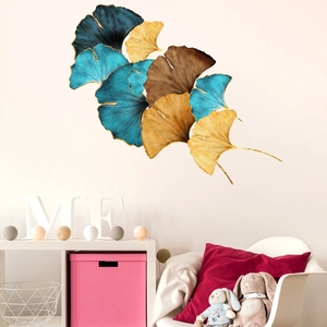 Artistic ginkgo leaf metal wall decor featuring blue and gold textured finish details