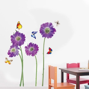 Detailed view of purple flower wall stickers and colorful butterflies in kids room