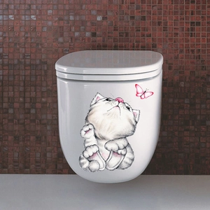 Detailed close-up of a cartoon cat and butterfly sticker applied to a white toilet lid