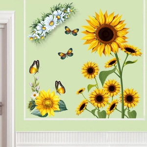 Detailed close-up of vibrant sunflower and butterfly wall stickers on a green wall