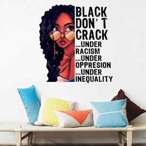 Detail of African woman wall decal with sunglasses and social justice quote in living room