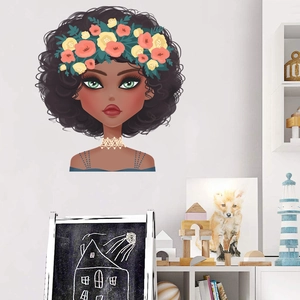 Detail view of African girl wall decal with floral crown in a cozy nursery room setting