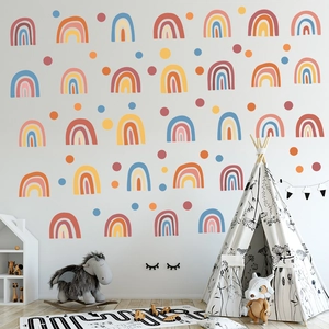 Nursery wall decals with bohemian rainbows and polka dots in earthy tones for kids room