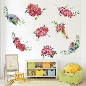 Detailed view of pink peonies and succulents watercolor wall stickers in a kids' bedroom