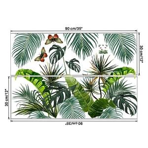 Detail of tropical plant wall stickers with monstera leaves and colorful butterflies