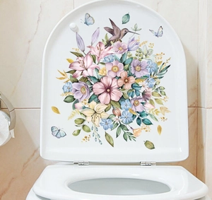 Lebhafte Kolibri und Blumen Aufkleber auf einem weißen Keramik Toilettendeckel