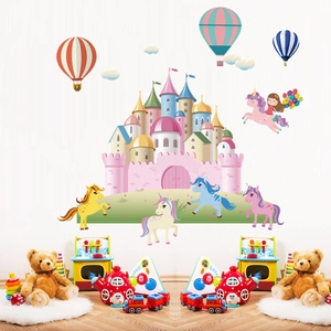 Detailed view of unicorn and castle wall decals in a cozy children room setting