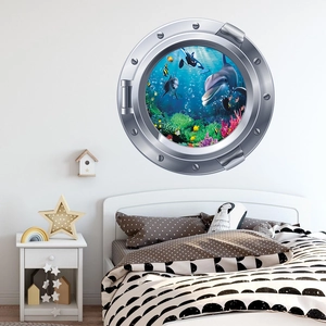 Détail du sticker mural 3D hublot de sous-marin avec dauphins et récif corallien coloré
