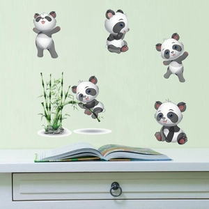 Detail of cute panda and bamboo wall decals applied on a soft green nursery room wall