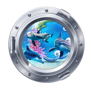 Détail d'un sticker mural hublot 3D avec dauphins et décor de récif corallien