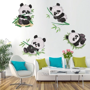 Detailed view of cartoon panda and bamboo wall decals in a modern living room