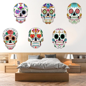 Detailed view of six colorful Mexican Day of the Dead sugar skull wall decals in a bedroom
