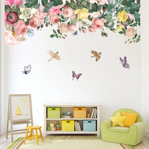 Wall decals featuring pink roses, green vines, colorful butterflies and flying birds