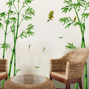 Detail of bamboo wall decals with yellow birds in a peaceful living room setting