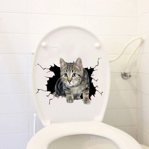 Detail view of 3D realistic tabby cat wall sticker with crack effect on white toilet lid