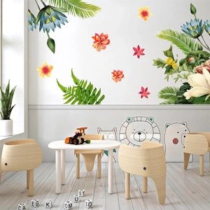 Tropical flowers and cartoon animal wall stickers in a cozy Nordic style playroom